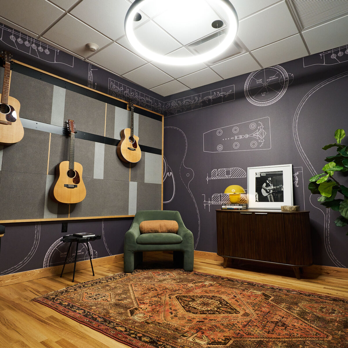 A room with dark paint with guitars hanging on the wall